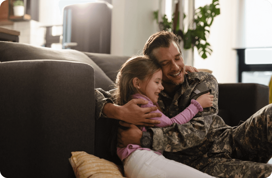 affectionate-military-father-his-daughter-embracing-with-eyes-closed-home@2x (1)