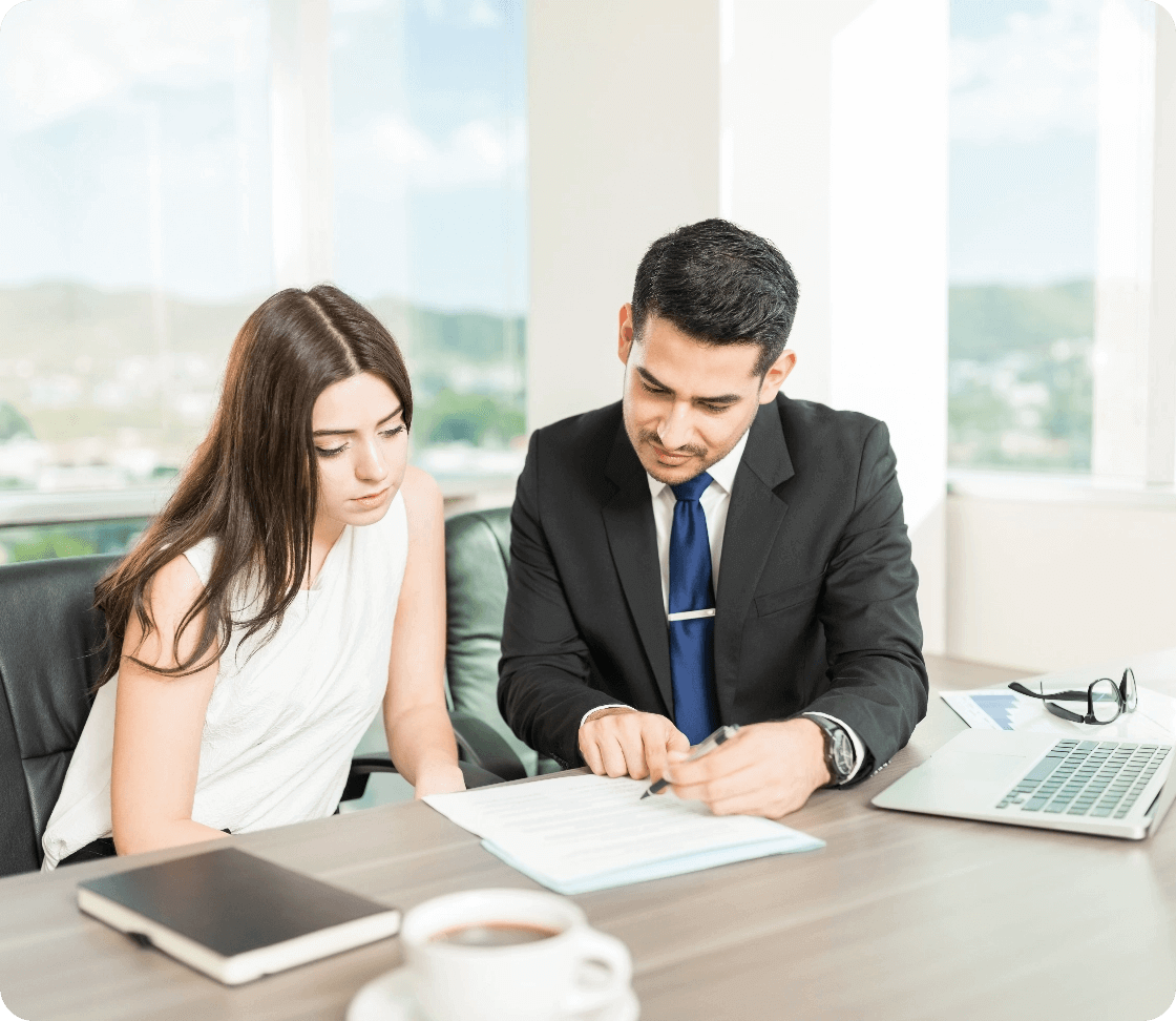 young-adviser-explaining-legal-document-client-his-office@2x (1)